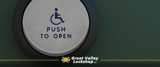 Push-button door opener for handicap accessibility on commercial building.