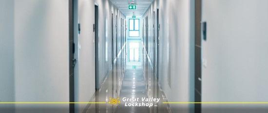 Log hallway in a college dormitory with keyless locks.