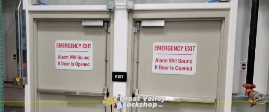 a set of commercial doors with an alarm system