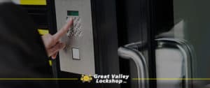 Man enters access code into a keypad lock.