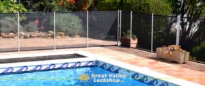 backyard pool surrounded by safety fence