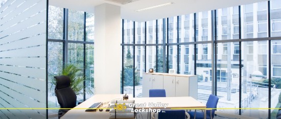 A modern office building that has smart tinted windows on the exterior and privacy film on interior glass.